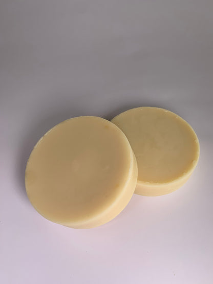 Two handmade Au Naturel lotion bars.