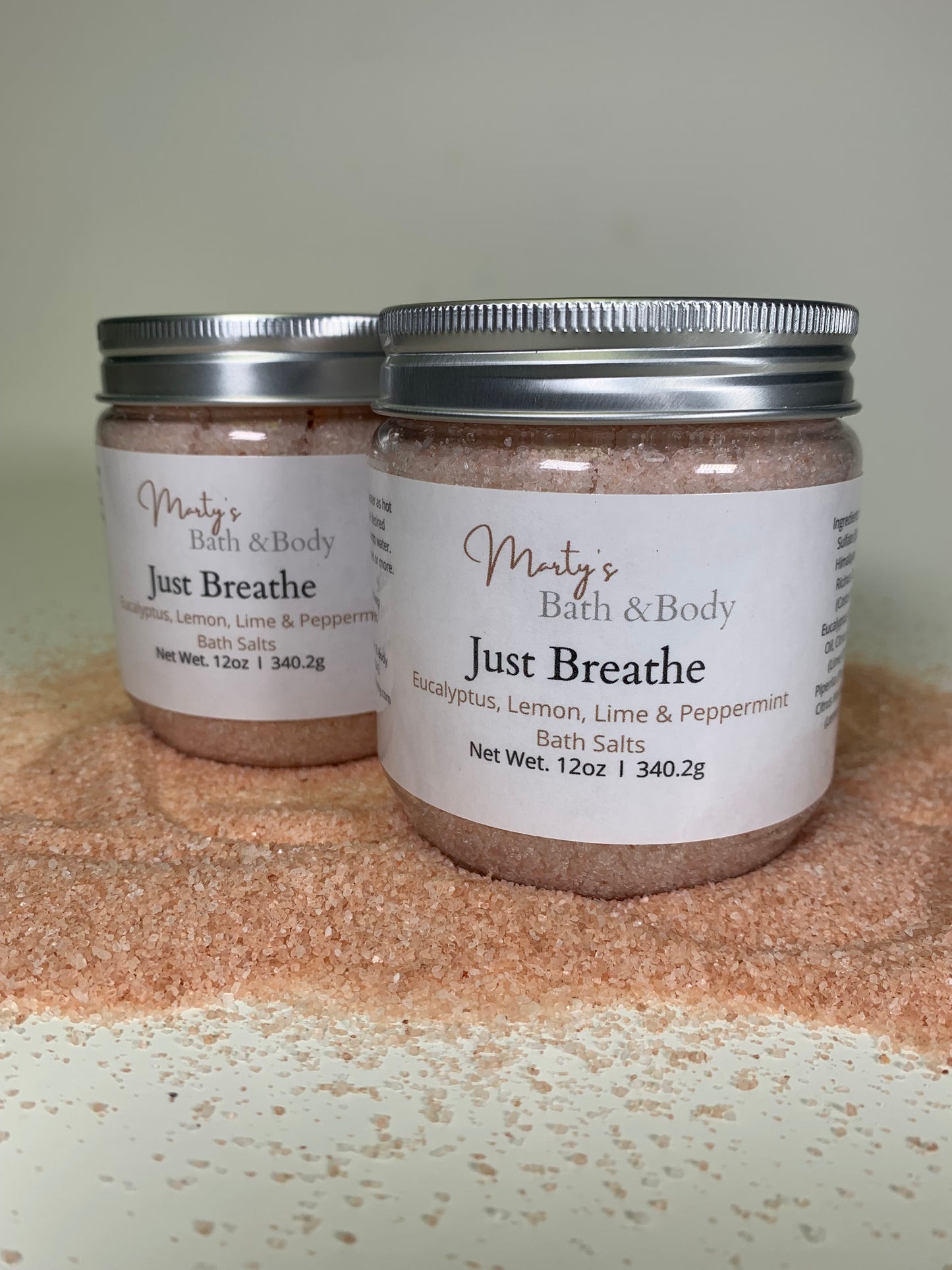 Two 12oz jars of Just Breathe bath salts/bath soaks with eucalyptus, lemon, lime, and peppermint pure essential oils.