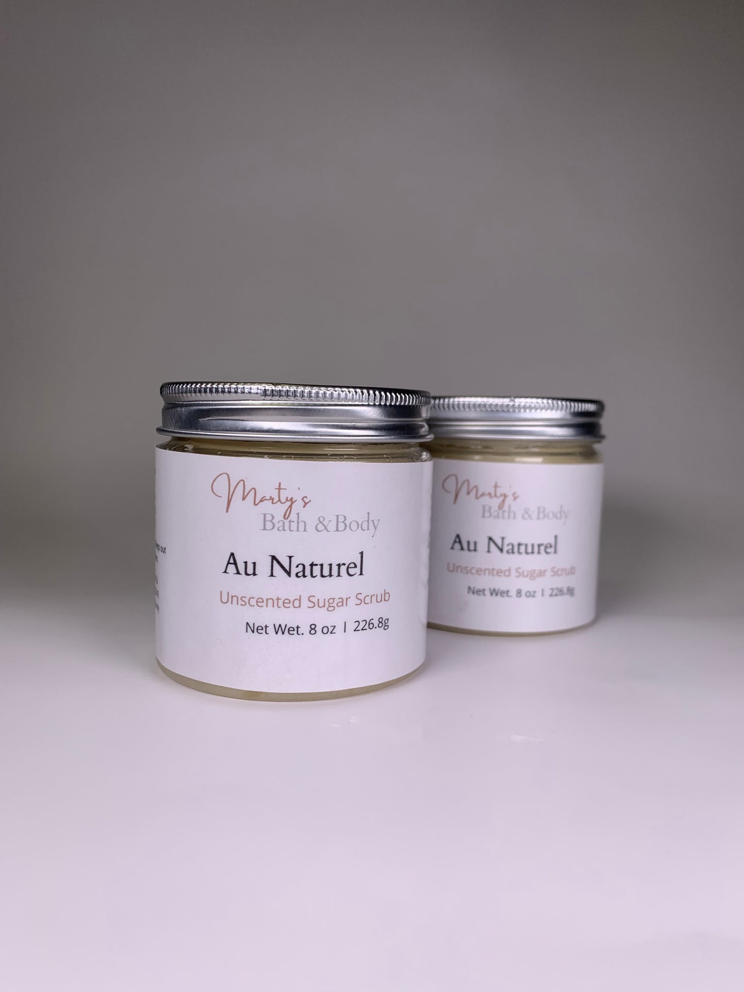 Two 8oz jars of handmade Au Naturel unscented sugar scrub.